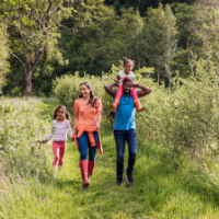 family walk in woods