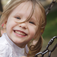 child having fun on swing