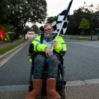Man in wheelchair ready to start Diverse Abilities Neon Run 2022