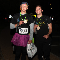 2 male runners who have completed Diverse Abilities' Dorset Neon Run 2022
