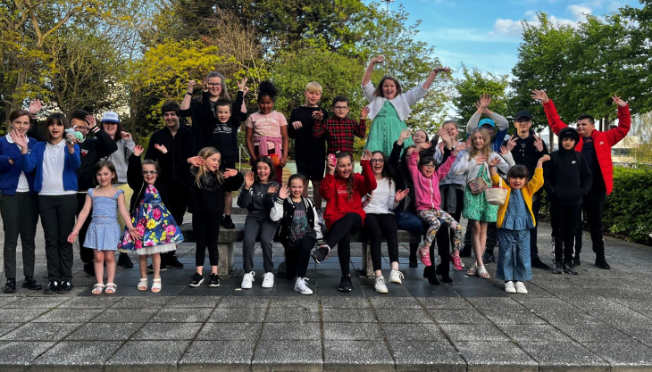 Young People Who Are Carers Cheering Outside Lighthouse Theatre Poole