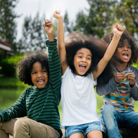 children cheering and smiling