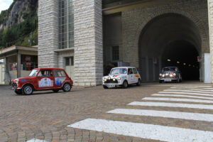 Three Minis emerging from a tunnel at a hydro-electric power station high in the Trentino Dolomites. This was a particularly unique stop for the Italian Job in 2017