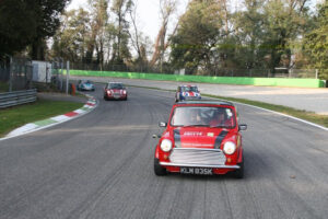 Italian Job Minis doing what they do best on parade laps of international Formula 1 circuits. Pictured here on Imola F1 circuit