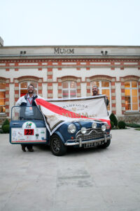 Freddie and a Mini on a pit stop at MUMM Champagne in Epernay, France