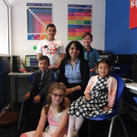 Kip McGrath Education Centres Wolverhampton West Director Jasleen Jodhka sits amongst her pupils