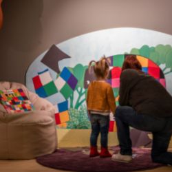 Family visiting the Elmer Exhibition