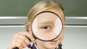 Girl with magnifying glass