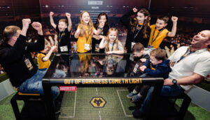 A family celebrating a win at the Wolves Museum