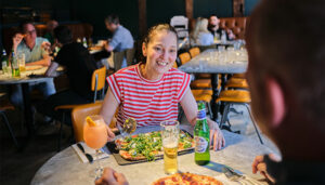 Women enjoying her food from PizzaExpress East Grinstead