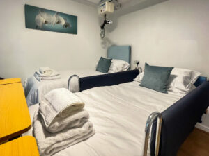 wheelchair accessible bedroom with profiling bed and hoist Rosedale