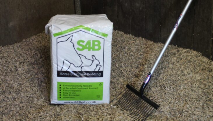 Bag of S4B Bedding next to a rake