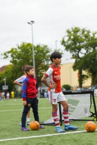 Boys playing football with Platform Sports Coaching for holiday camps and weekly classes for children