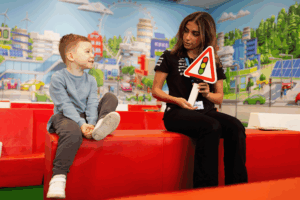 A family at Mercedes Benz World in Weybridge, Surrey enjoying the interactive attraction Little Learners