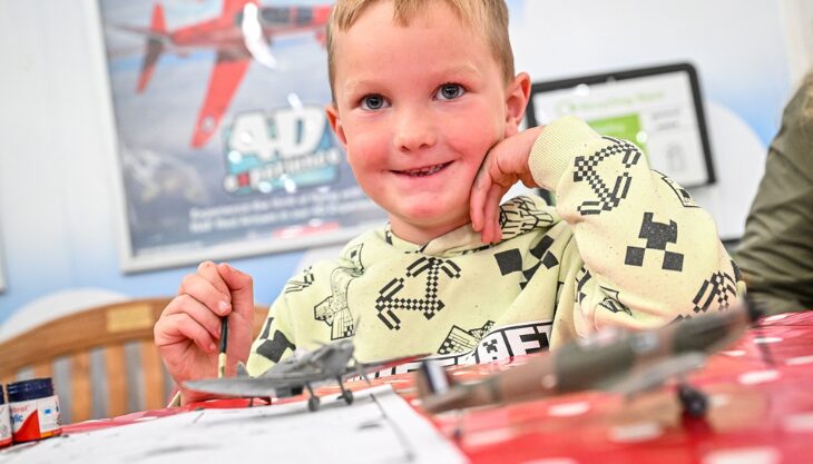 A Child Making An AirFix Model At RAF Museum Midlands Cosford